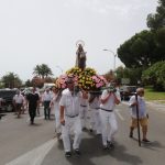 subiendo a la Virgen después de la procesión Virgen del Carmen en Campoamor